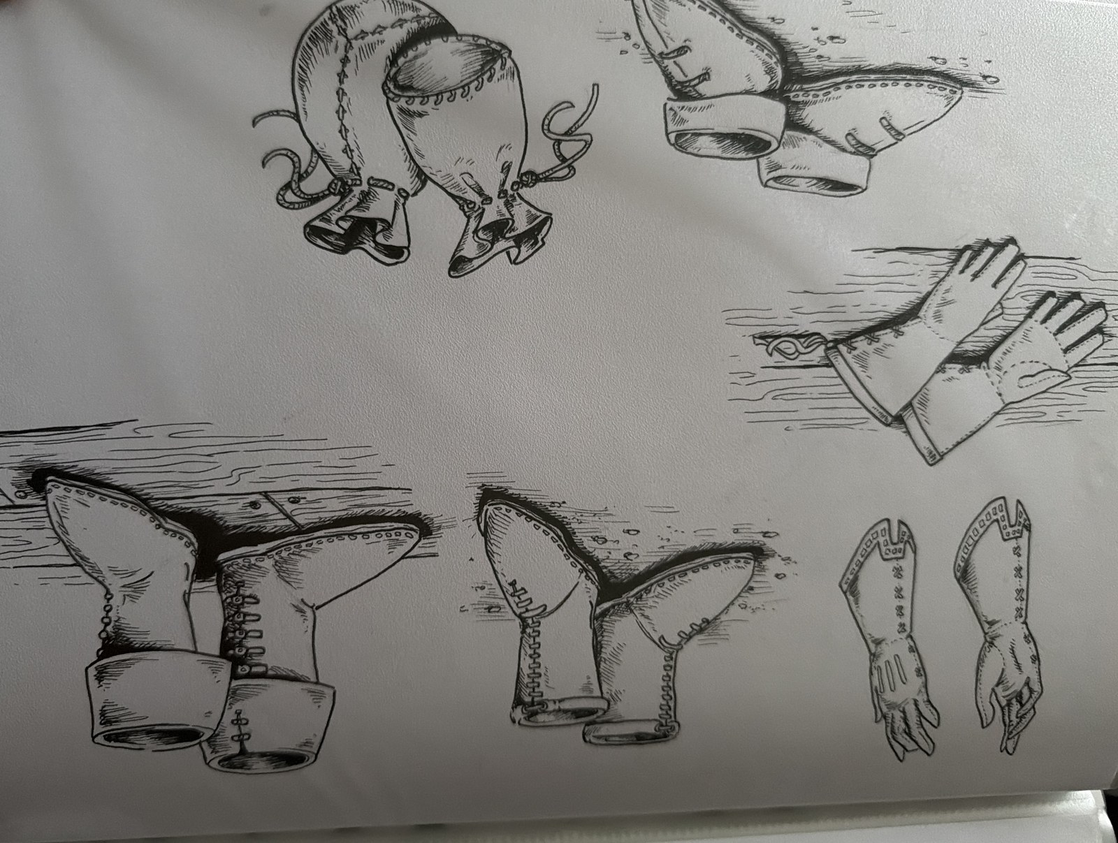 An ink study page from the 1990s of medieval boots, gloves and leather pouches.